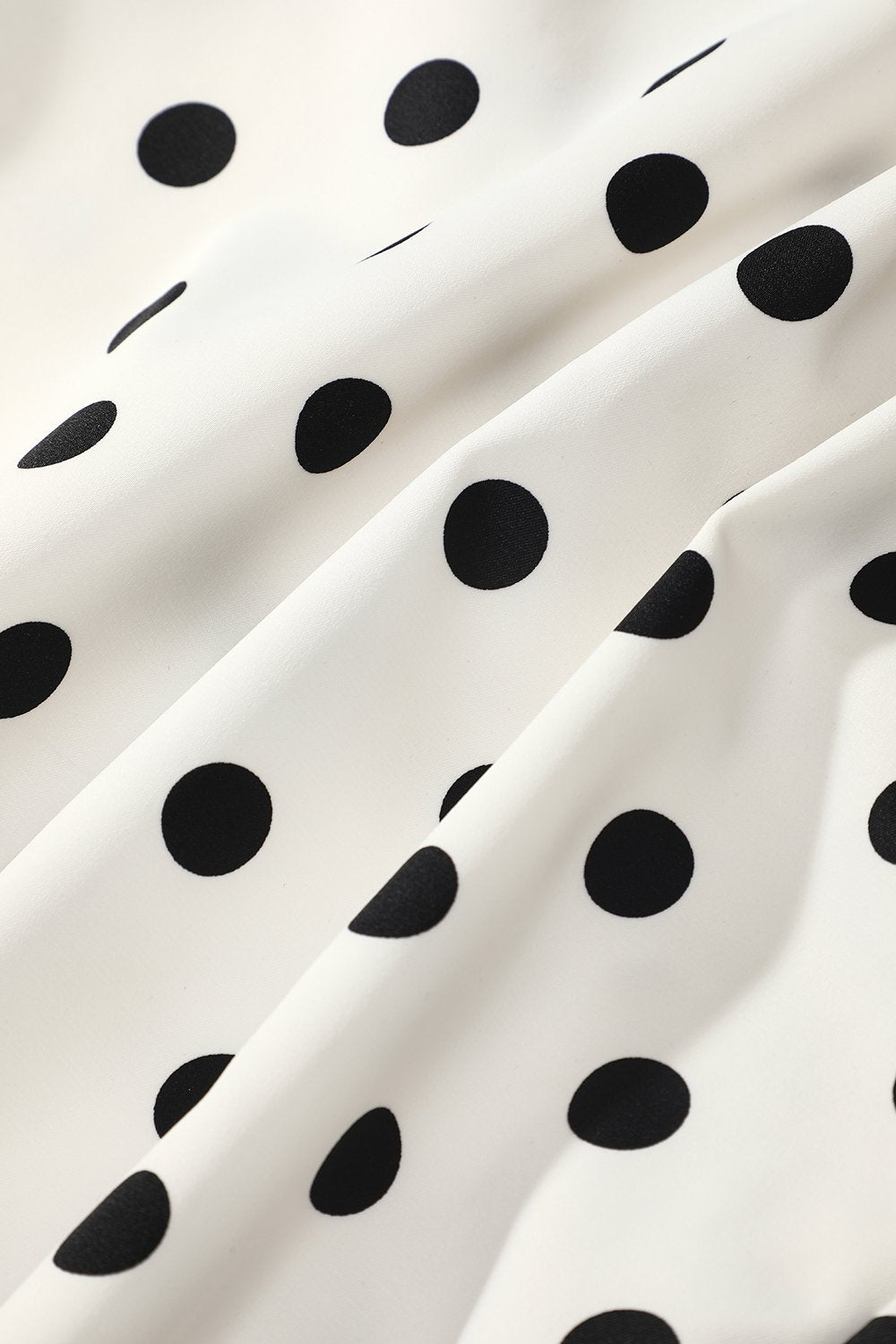 Czarno-biała Sukienka w Groszki z Syrenim Wykończeniem