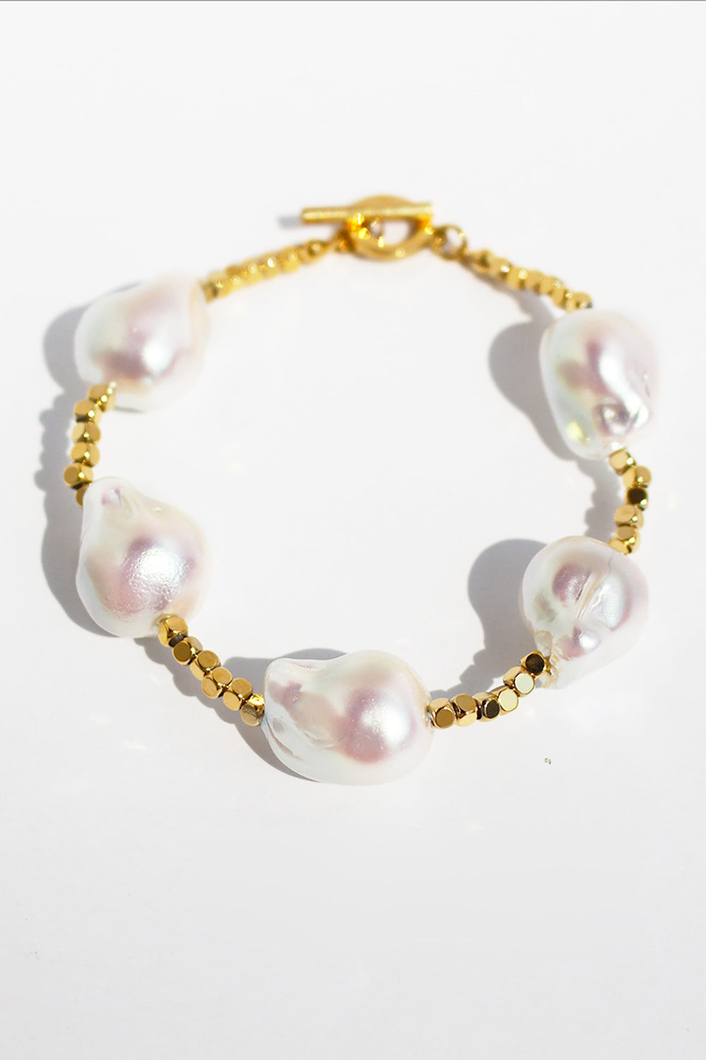 Złota bransoletka z pereł w kształcie