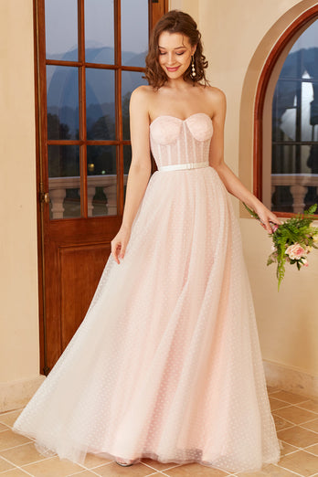 Różowa suknia ślubna w groszki z bufiastymi rękawami