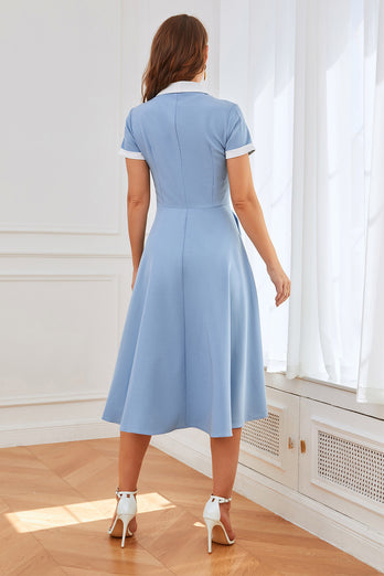 Niebieska sukienka swingowa z lat 50-tych z kieszeniami