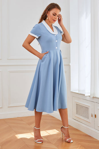 Niebieska sukienka swingowa z lat 50-tych z kieszeniami